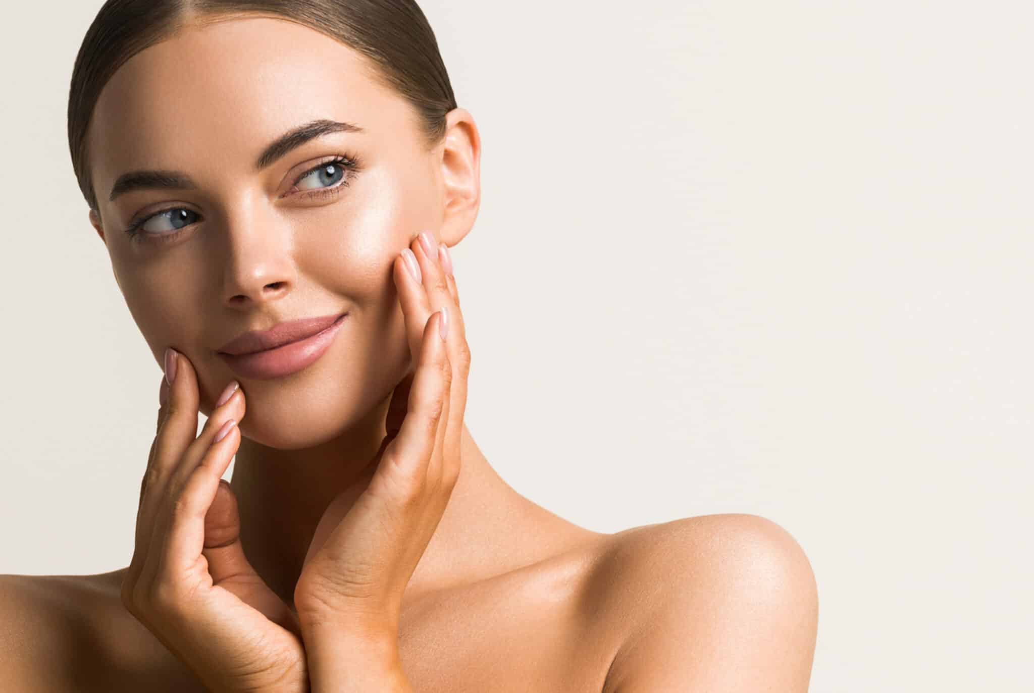 Beautiful female touching hand skin clean natural make up fresh